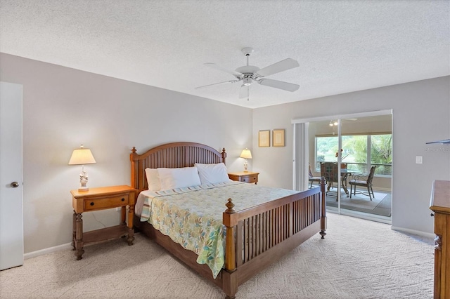 carpeted bedroom featuring a textured ceiling, access to outside, and ceiling fan