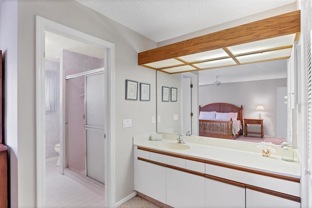 bedroom featuring a textured ceiling and sink