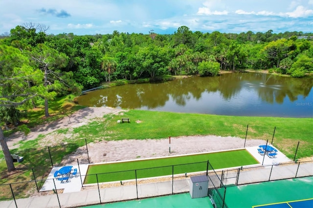 surrounding community featuring a water view