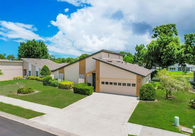 425 Cypress Forest Dr, Englewood, FL 34223 - mid-century inspired home featuring a front yard, an attached garage, driveway, and stucco siding