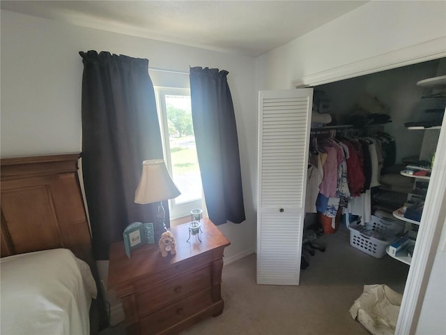 carpeted bedroom with a closet