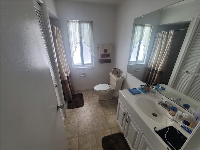 22481 Westchester Blvd Unit B40, Punta Gorda, FL 33980 - full bath with healthy amount of natural light, vanity, toilet, and a shower with shower curtain