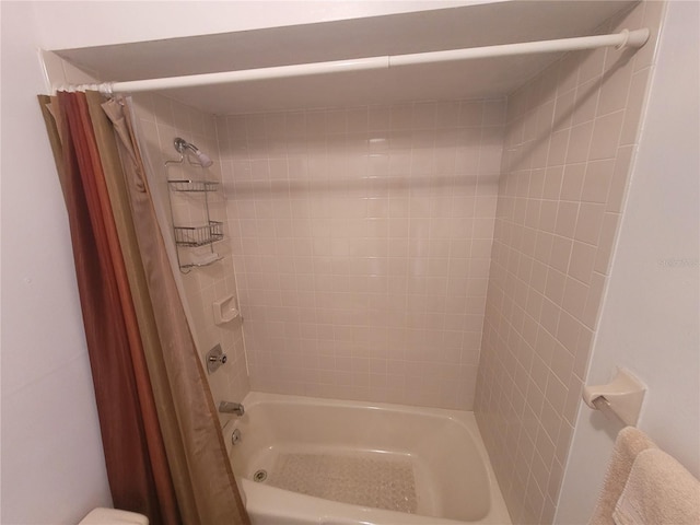 bathroom with shower / tub combo with curtain