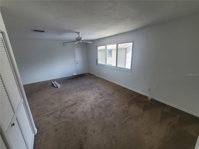 unfurnished bedroom featuring carpet floors and ceiling fan