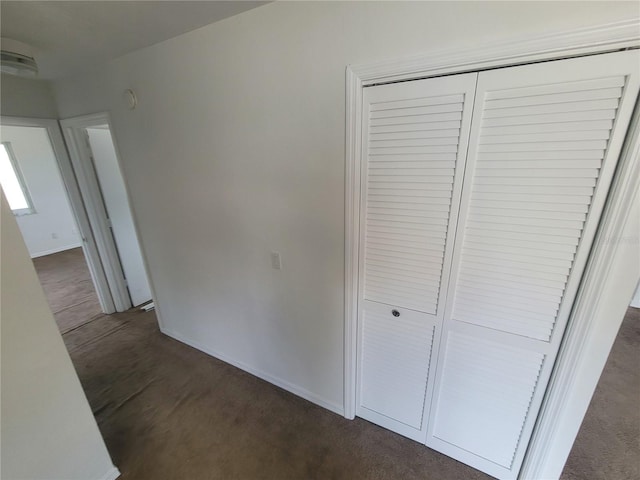 22481 Westchester Blvd Unit B35, Punta Gorda, FL 33980 - corridor featuring baseboards and dark carpet