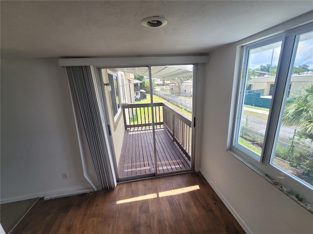 empty room featuring dark hardwood / wood-style flooring