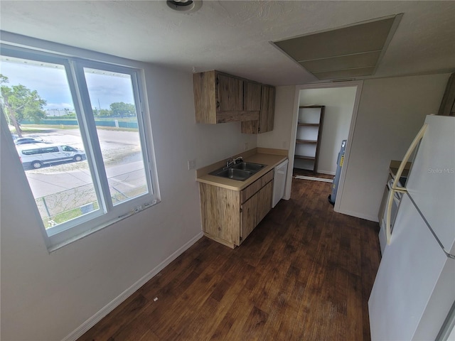 22481 Westchester Blvd Unit B35, Punta Gorda, FL 33980 - kitchen with a sink, white appliances, light countertops, and dark wood-style flooring