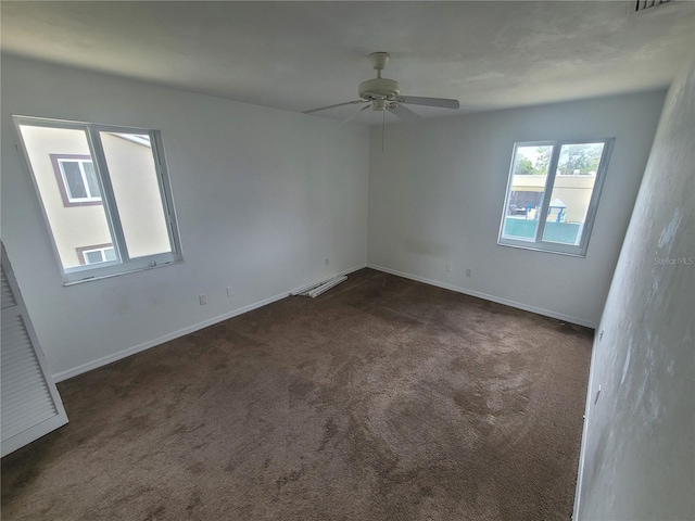22481 Westchester Blvd Unit B35, Punta Gorda, FL 33980 - spare room featuring dark carpet, a ceiling fan, and baseboards