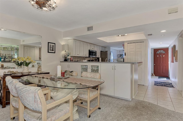 dining room with light tile patterned flooring