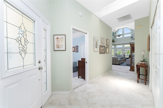 foyer entrance with high vaulted ceiling