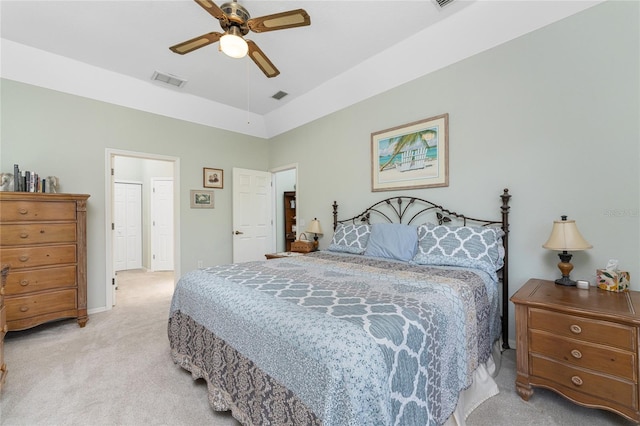 carpeted bedroom with vaulted ceiling and ceiling fan