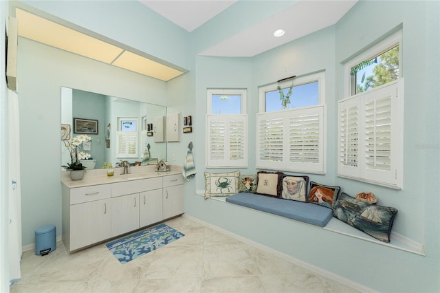 bathroom featuring tile patterned floors, plenty of natural light, and vanity