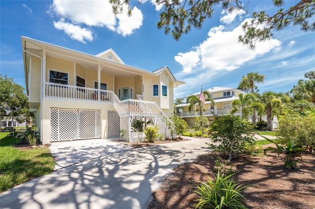 coastal home featuring a porch