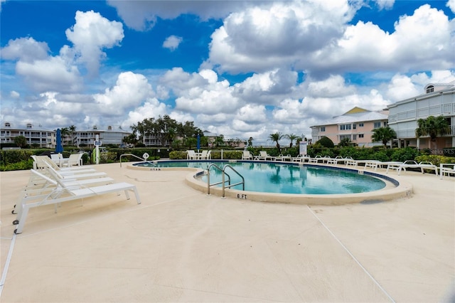 view of swimming pool with a patio