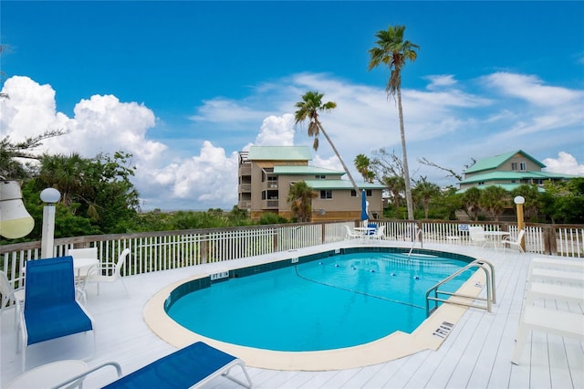 view of pool with a wooden deck