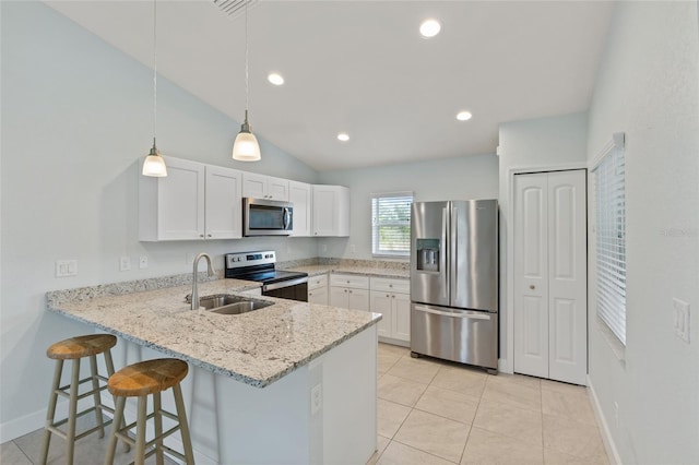 kitchen featuring sink, light tile patterned floors, light stone counters, white cabinets, and appliances with stainless steel finishes