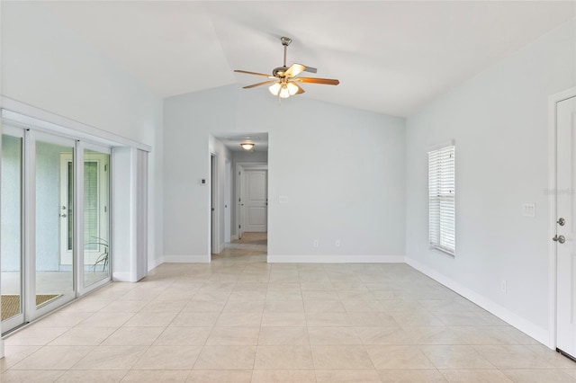 empty room featuring ceiling fan, lofted ceiling, and light tile patterned floors