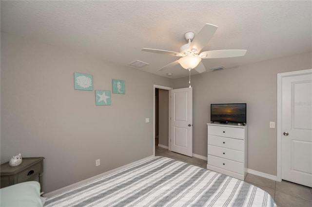 bedroom featuring ceiling fan and light tile patterned flooring