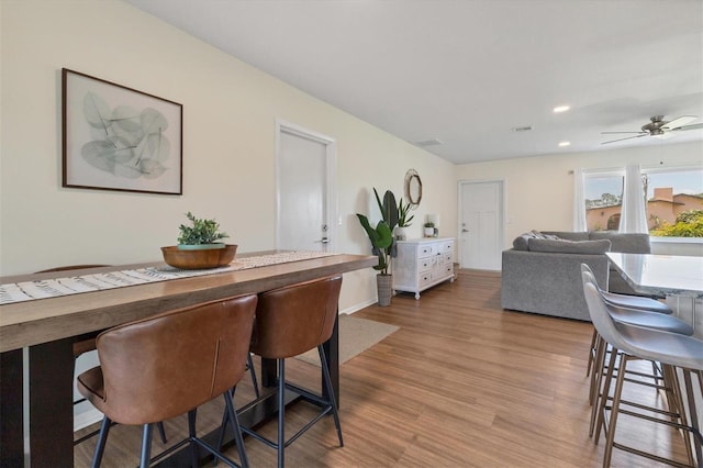 dining room featuring ceiling fan and light hardwood / wood-style flooring