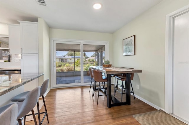 dining area with light hardwood / wood-style flooring