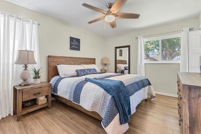 bedroom featuring ceiling fan and light hardwood / wood-style floors