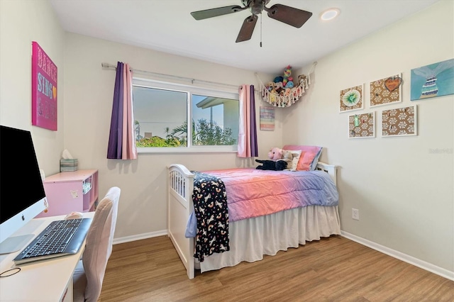 bedroom with ceiling fan and light wood-type flooring