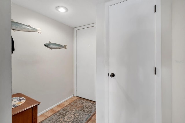 doorway featuring light tile patterned floors