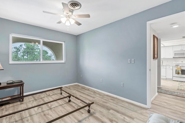 bedroom featuring light hardwood / wood-style flooring and ceiling fan