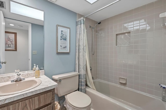 full bathroom with vanity, toilet, and shower / bath combo with shower curtain