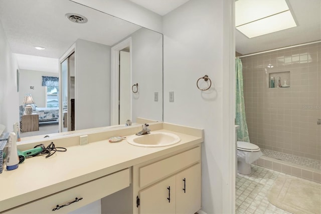 bathroom with tile patterned floors, vanity, toilet, and a shower with shower curtain