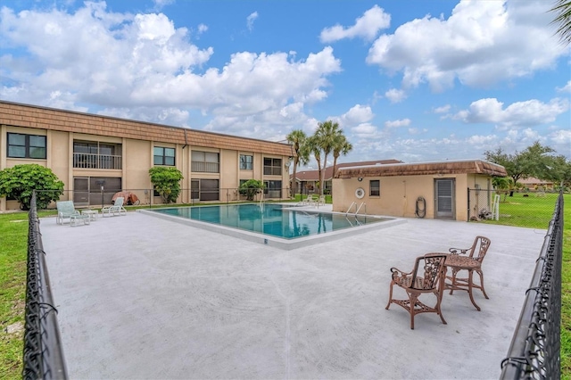 view of swimming pool with a patio