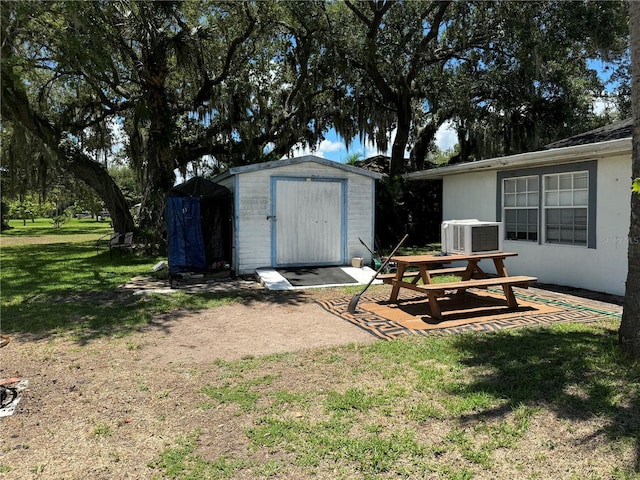 4029 E Sunflower Cir, Labelle, FL 33935 - view of yard featuring central AC unit and a storage unit