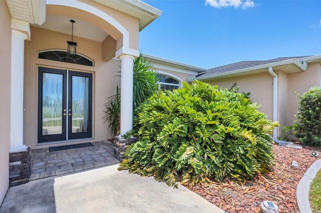 property entrance featuring french doors