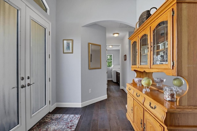 corridor with dark hardwood / wood-style flooring