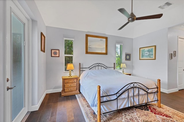 bedroom with ceiling fan and dark wood-type flooring