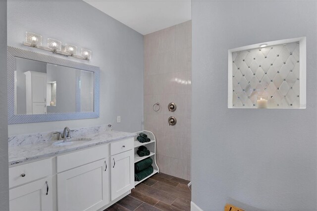 bathroom with hardwood / wood-style floors and vanity