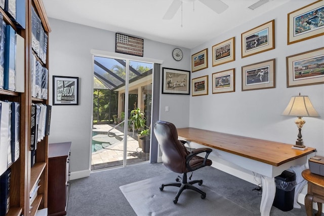 carpeted home office featuring ceiling fan and a healthy amount of sunlight