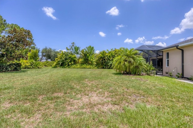 view of yard featuring a lanai