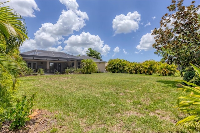 view of yard featuring a lanai