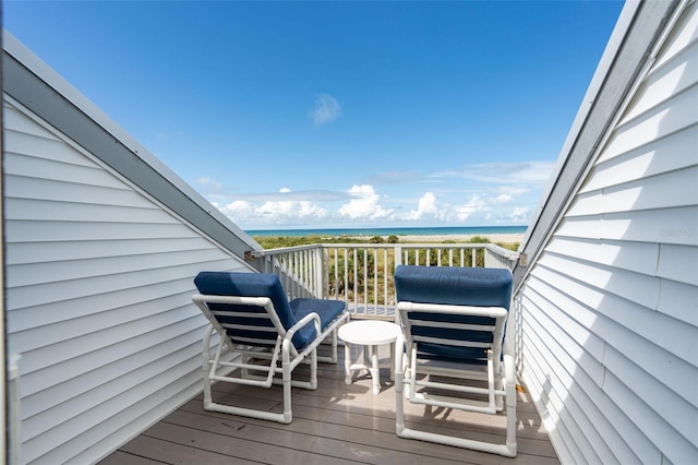 wooden terrace featuring a water view