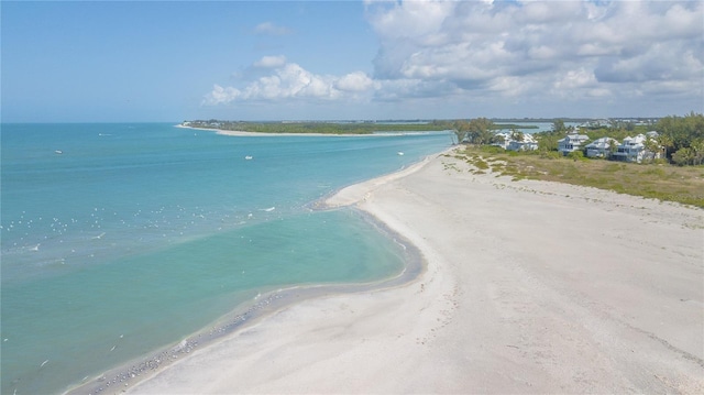 aerial view with a view of the beach and a water view