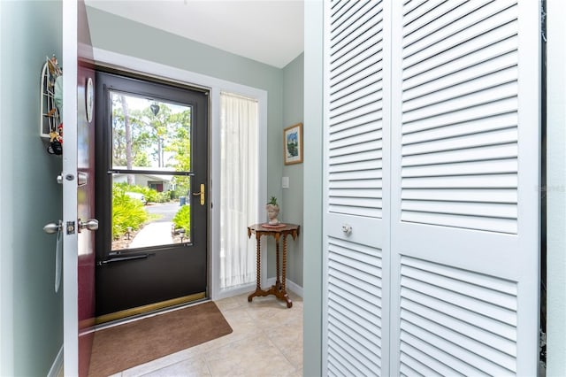 entryway featuring light tile patterned floors