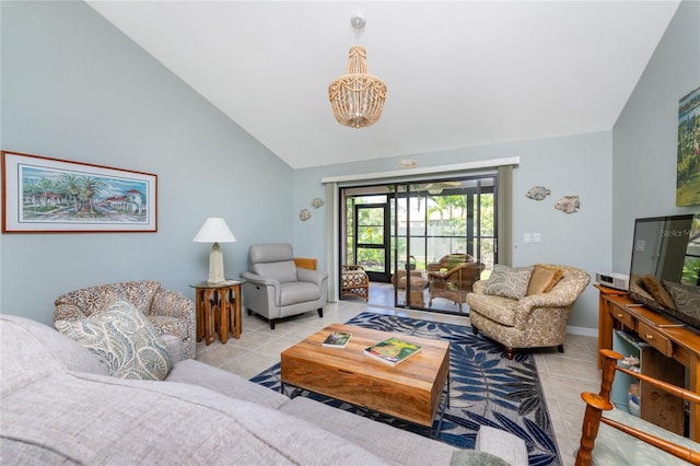 living room with a notable chandelier, light tile patterned flooring, and lofted ceiling