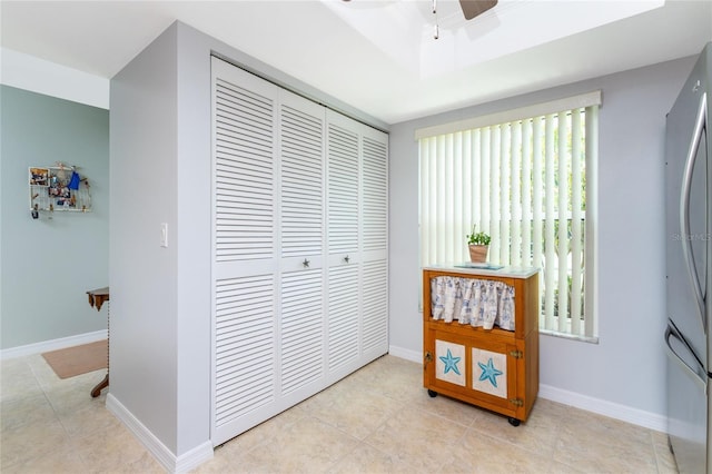 corridor featuring light tile patterned floors