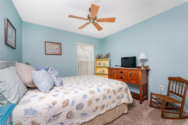 bedroom with carpet flooring, ceiling fan, and a textured ceiling