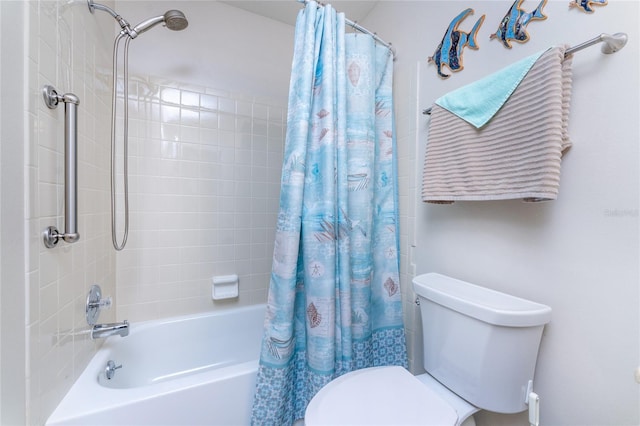 bathroom with shower / tub combo and toilet