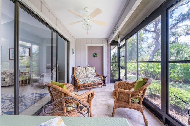 sunroom with ceiling fan and a healthy amount of sunlight