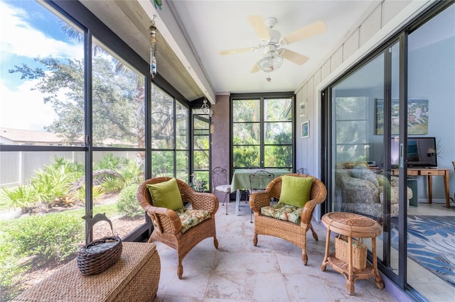 sunroom / solarium with ceiling fan