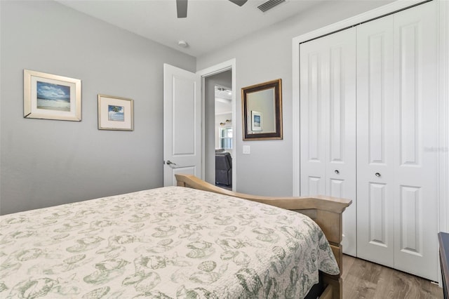 bedroom featuring light wood-type flooring, a closet, and ceiling fan