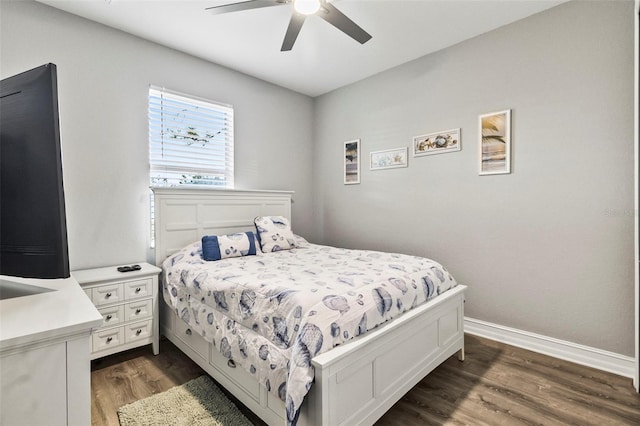 bedroom featuring dark hardwood / wood-style flooring and ceiling fan